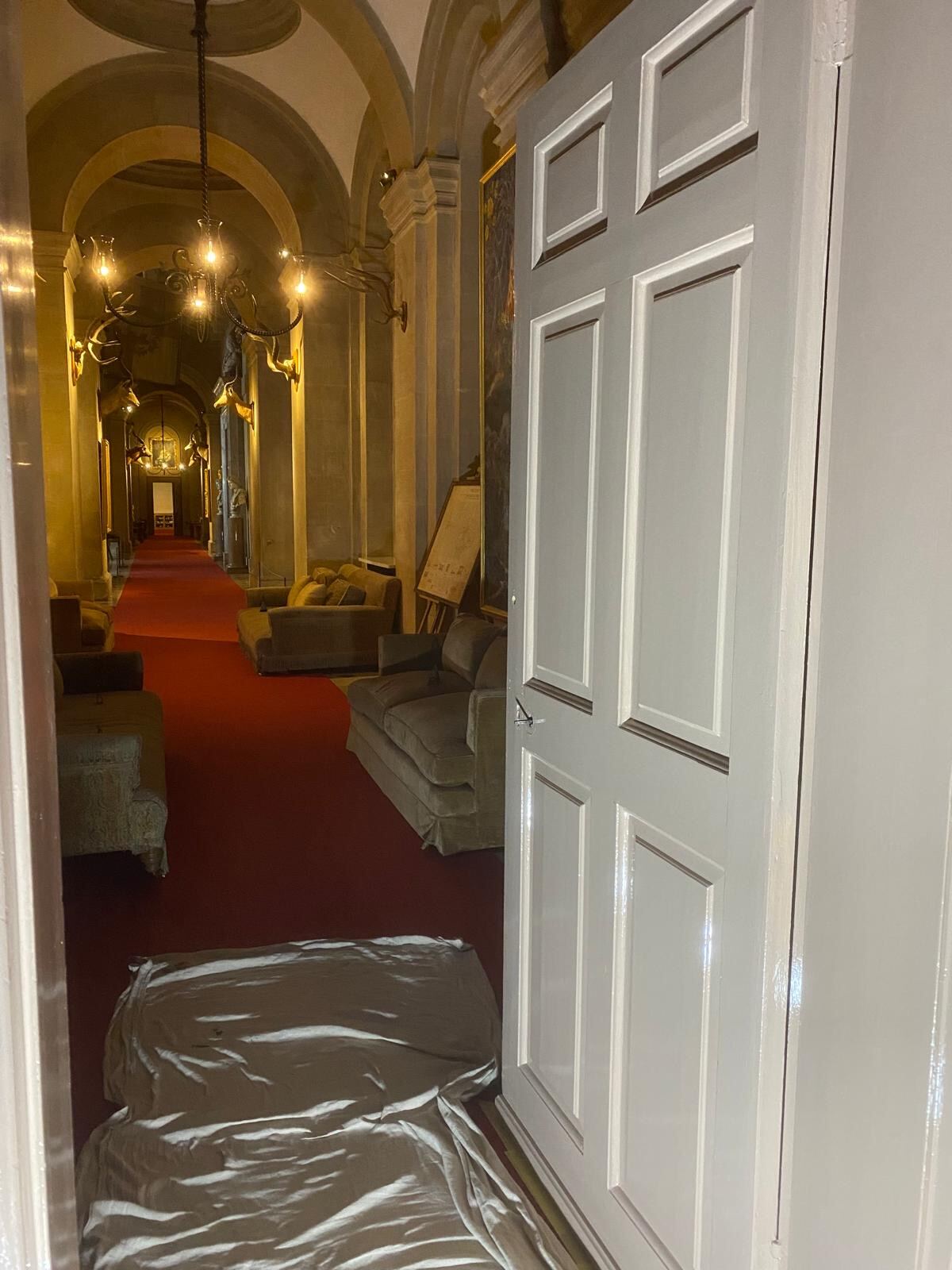 Vaulted long corridor with freshly painted heritage door at Blenheim Palace by Brierty Decoration
