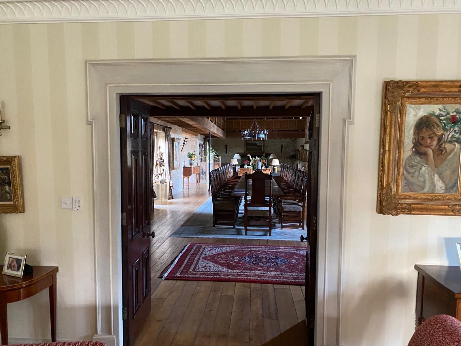 Stripe wallpaper run plumb through a connecting doorway in a Henley-area period home